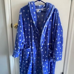 Soft robe that has stars and the moon on it.